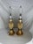 Pair of Gold Pineapple Table Lamps. These are substantial lamps given their size and weight. The gold color adds an...
