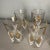 Set of eight highboys / tall tumblers with white and gold wheat designs. The glasses are free from chips or cracks. Some...