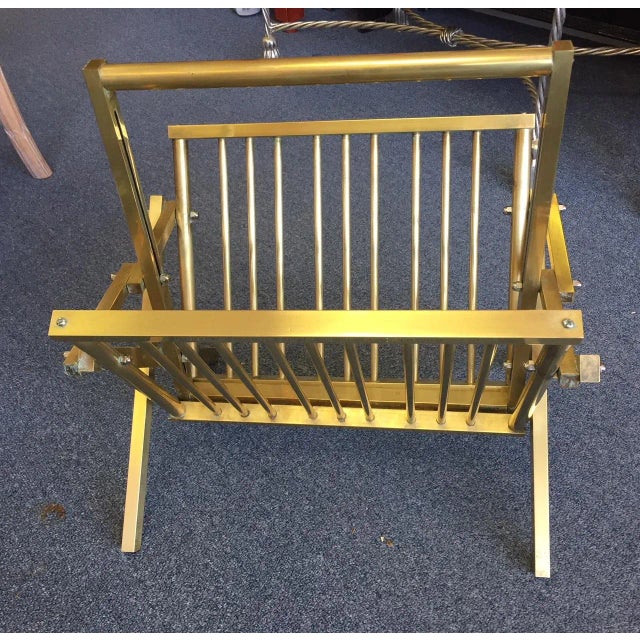 Stylish vintage polished brass campaign style magazine rack. It folds to a 5" depth. Perfect for a little extra storage...