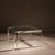 ​This striking square coffee table is an exceptional statement piece of 1970s Hollywood Regency design. It impresses with...