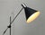 Minimalist mid-century floor lamp. A simple design with a minimalist aesthetic. The lamp head features a classic conical...