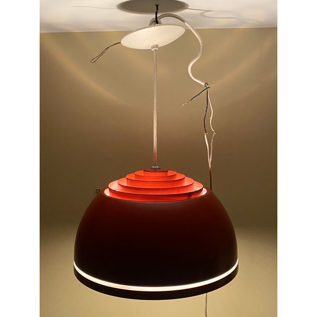1960s Louvered lightolier dome pendant lamp in the manner of Verner Panton. The Burnt Orange enameled form features...
