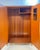 Mid-20th-century burl wardrobe by the prestigious maker Hunters of Derby Ltd. Founded in 1928, the historic British...