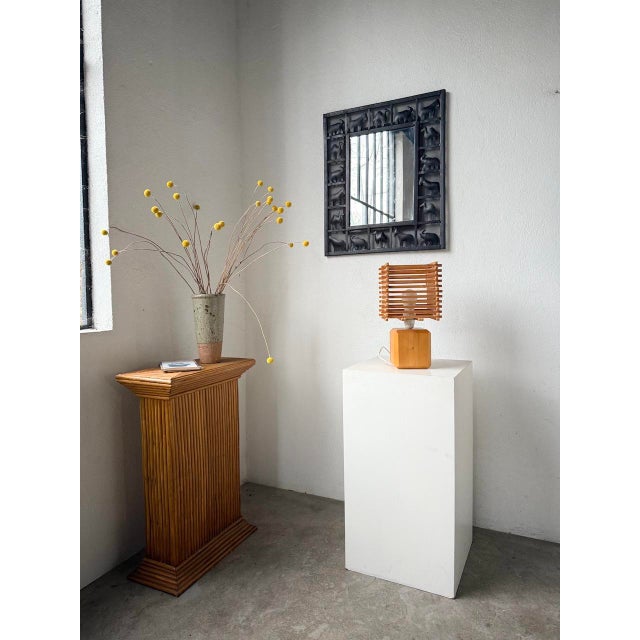 Small wooden (pine) table lamp in a 1980s constructivist style. with its solid wood base and slatted wooden shade, this...