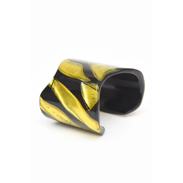 This is part of Chairish’s Costume Jewelry assortment. The juxtaposition of embedded chartreuse resin that looks like foil...