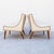 A pair of low profile leather lounge chairs with antiqued nailhead detailing by Selig, made in the United States c. late...