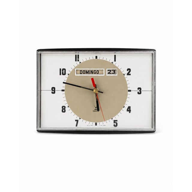Jaz Transistor wall clock, Lignic model, 2nd generation, produced from 1971 to 1975. Black plastic frame with a...