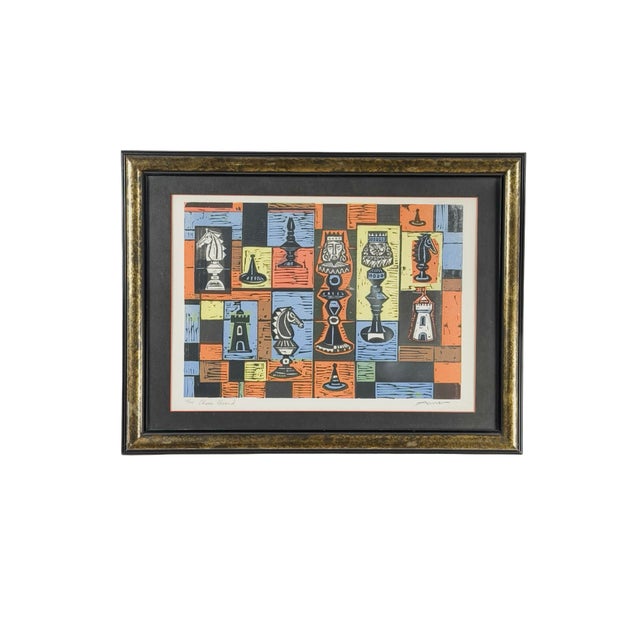 “Chess Board” by Irving Amen is a colorful woodcut with a distinctly Mid-Century Modern composition. Stylized chess pieces...