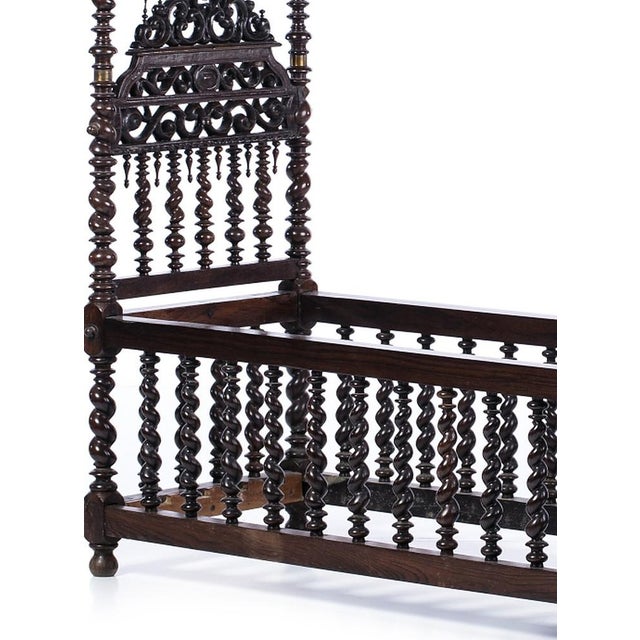 17th-century Portuguese cradle with canopy, made of Noble Wood. Features a 3-level headboard and spiral-turned uprights....