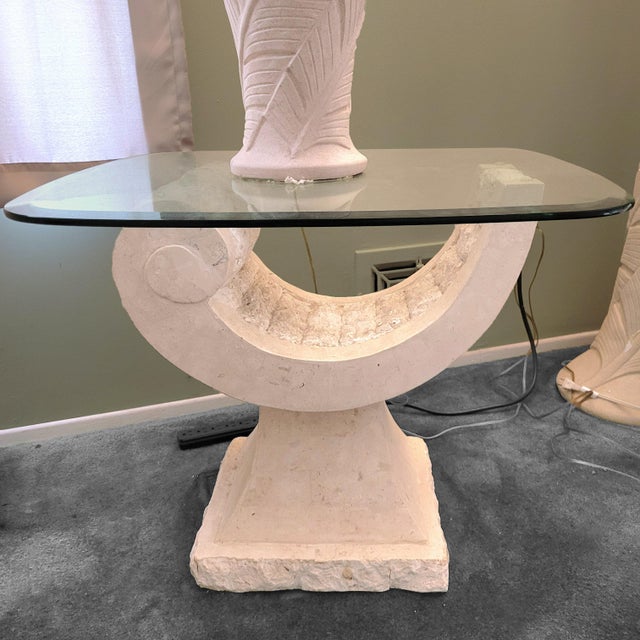 Postmodern sculptural natural mactan stone side table. Circa 1980s. Sculptural postmodern pedestal with a contrasting...