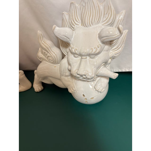 This pair of Foo Dogs were originally nestled at the entrance of temple palaces and homes. This exceptionally large pair...