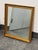 Design Plus Gallery presents a Vintage Ornate Gold Framed Mirror. The mirror has a gold tone frame with raised floral and...