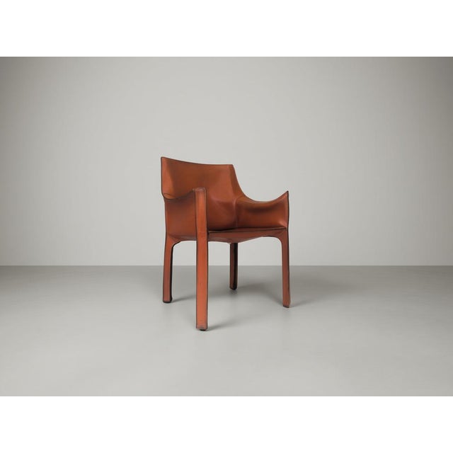 Iconic CAB 413 armchair designed by Mario Bellini for Cassina in the 1970s. Executed in thick saddle leather stretched...