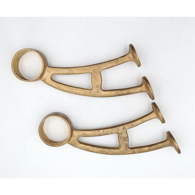 Reclaimed brass bar mount brackets designed to support rail tubing, commonly used for bar foot rails, handrails, or dance...
