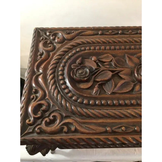 This 1880s Oversized Victorian Carved Wood Jewelry Box is quite unique in that it stands on thin, carved legs. The flower...