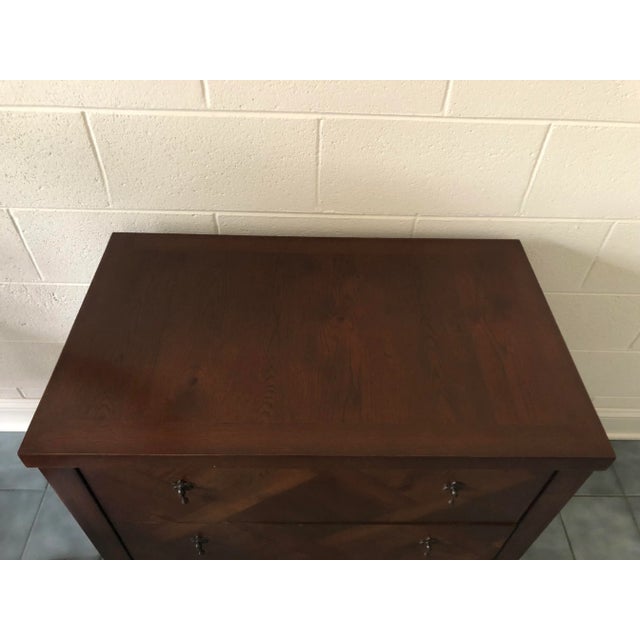 The subtle patterned veneers on this lovely 3 drawer nightstand are what gives the simple design presence in your room....
