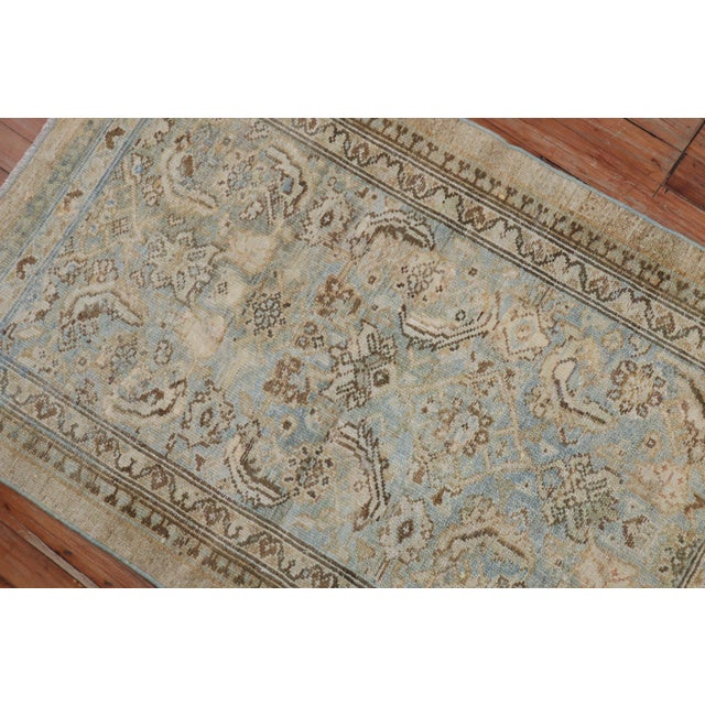 An early 20th century traditional Persian Serab mat in powder blue and camel accents. Measures: 2'7" x 4'1".