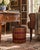 A wonderfully eccentric mid-20th-century English waste basket designed as a circular arrangement of richly aged leather-...