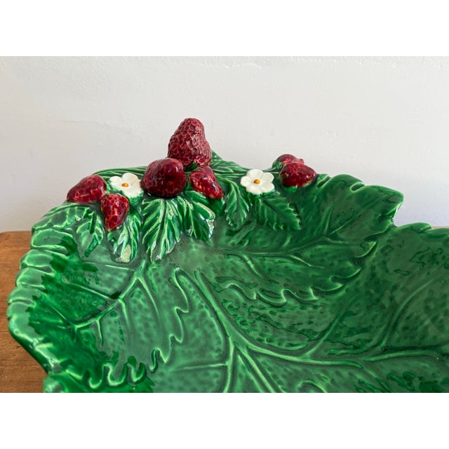 Lovely deep green majolica leaf form bowl with strawberries in relief, made in Italy. Please see condition details noted....