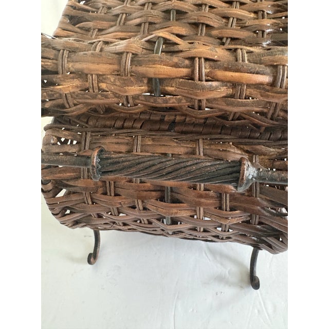 A beautifully preserved antique sewing basket dating to the early 20th century, crafted in handwoven wicker with...