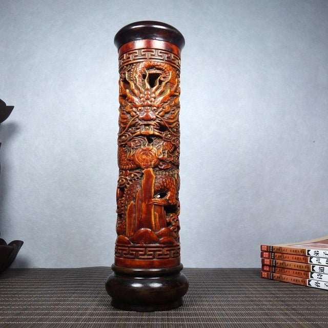 This is a finely carved antique rosewood incense tube, a traditional accessory used for storing stick incense. The...