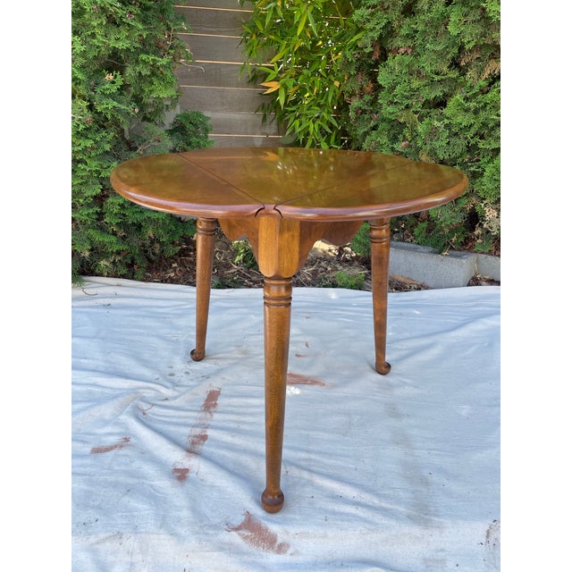 Vintage side table by Ethan Allen from their Heirloom Nutmeg Maple collection, model #0871, in solid maple with the...