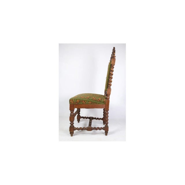 High-backed chair in solid oak with the style of the renaissance from around the year 1910. Dimensions in cm: h: 118 w: 50...