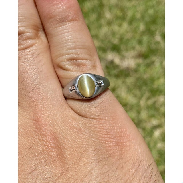 Top quality Chrysoberyl Cat's Eye mounted in a classy brushed Platinum finish ring setting. Mystical and mysterious green...