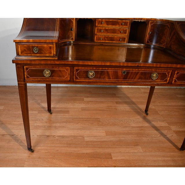 We are pleased to offer this beautiful English Carlton writing desk, from the 1930. This desk is made of Mahogany wood,...