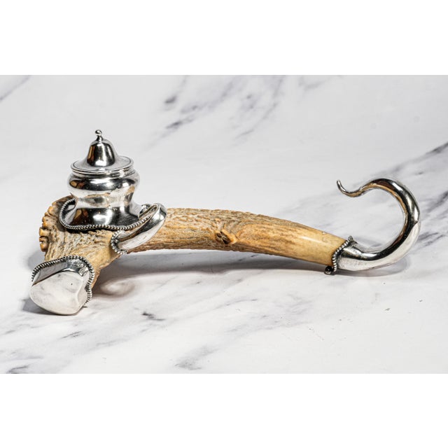 An extraordinary example of Victorian ingenuity and craftsmanship, this antique antler and sterling silver inkwell...
