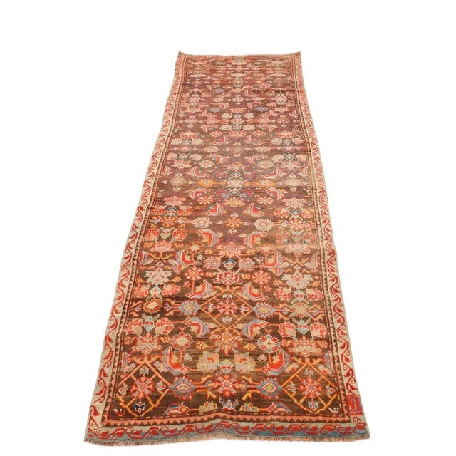 Antique handknotted wool Malayer runner rug. Approximately 80-90 years old. In very good condition.