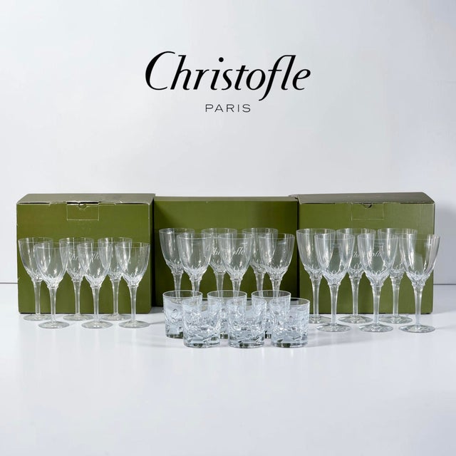 An exceptional and remarkably preserved 24-piece crystal glass service by Christofle Paris, presented in its original...