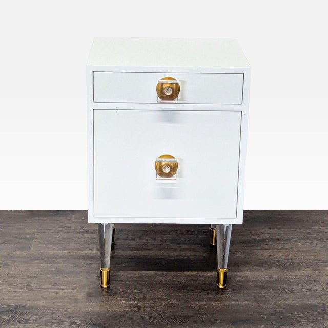 One drawer and cabinet with one shelf. Item has lucite and brass legs and hardware. Dimensions (in): 19W x 18D x 29H.