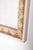 This elegant rectangular mirror features a finely crafted wooden frame, painted in a soft light green with delicate gilt...