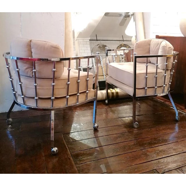 A pair of unusual chrome spindle armchairs with casters, by Drexel, USA, 1970s. The original velvet upholstery is a very...