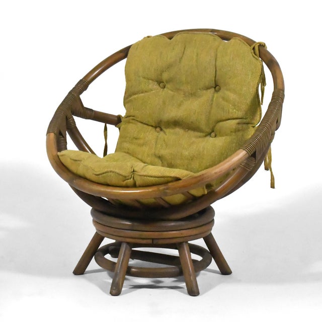A delightful organic modern design by Clark Casual, this rattan lounge has a round seat reminiscent of Eero Arnio...