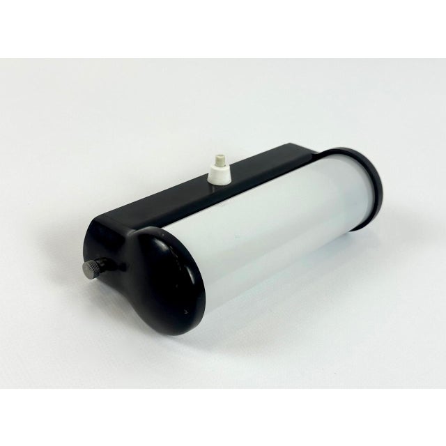 Bauhaus Bakelite Tubular Wall Lamp, 1930s, in Restored conditions. Designed 1920 to 1949 European Plug (up to 250V).The...
