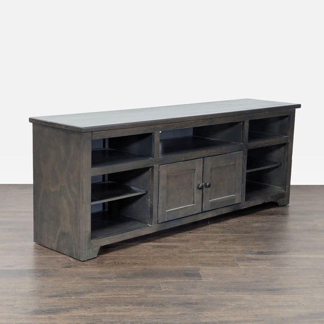 Nine shelf console with 2 cabinet doors. Brand: Progressive Furniture. Dimensions (in): 70W x 17D x 27H.