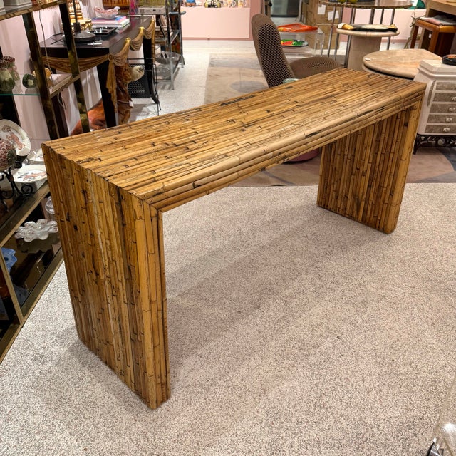 A beautifully 1970's bamboo console table in the style of Italian designer Gabriella Crespi. Intricate detail throughout,...