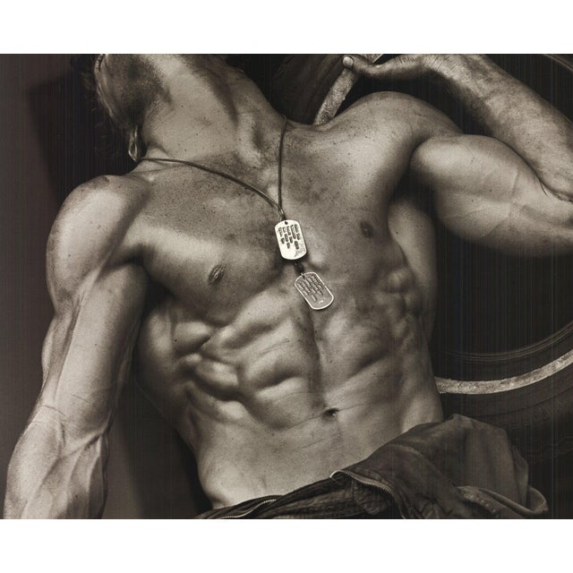 Artist: Herb Ritts Title: Fred with Tires I Year: 2002 Signed: No Medium: Offset Lithograph Paper Size: 23.5 x 31.5 inches...