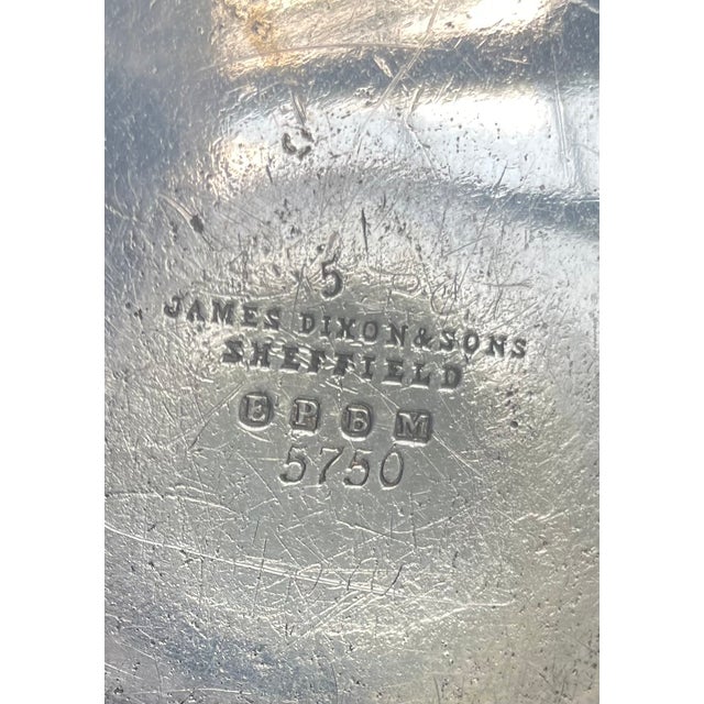 Well loved teapot. Made by James Dixon and Son, Sheffield - a Baltimore assay marks show EPMB 5750 . 9 inches to top of...