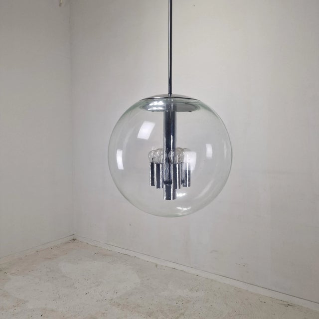 This impressive extra large pendant light by Glashütte Limburg features a striking minimalist design with a large glass...