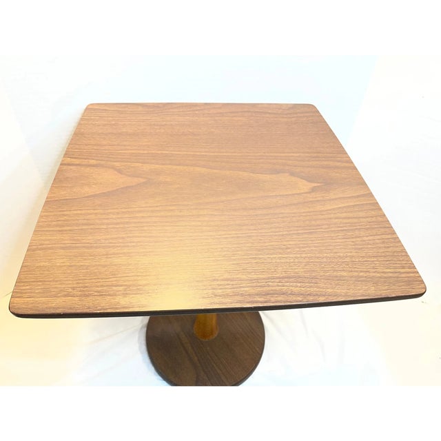 Bring timeless Mid-Century style to your home with this Vintage Walnut End Table. Featuring clean lines, a warm walnut...
