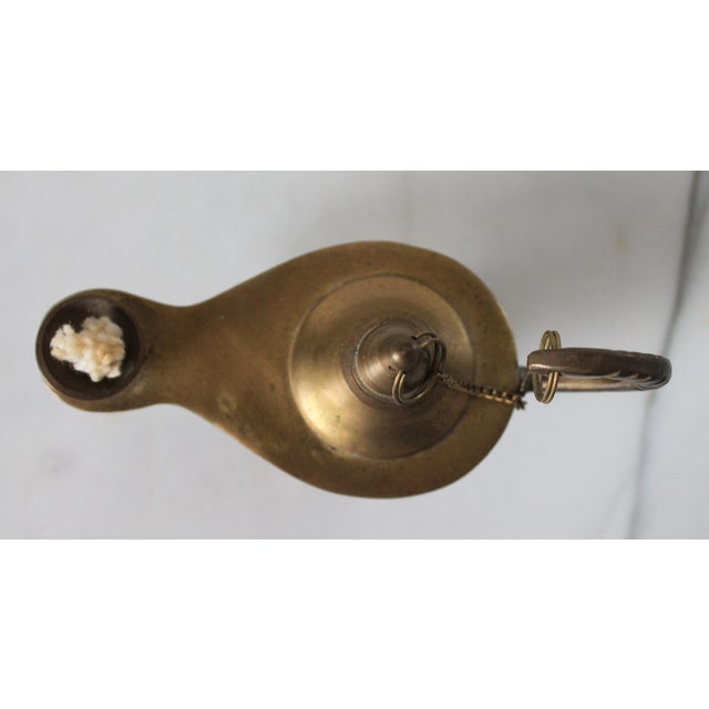 Vintage small brass Aladdin's genie-style oil lamp. No makers mark. Patina.