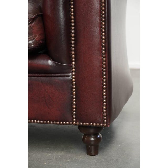 Cowhide Chesterfield 2.5-Seater Sofa in Oxblood Red For Sale - Image 11 of 14