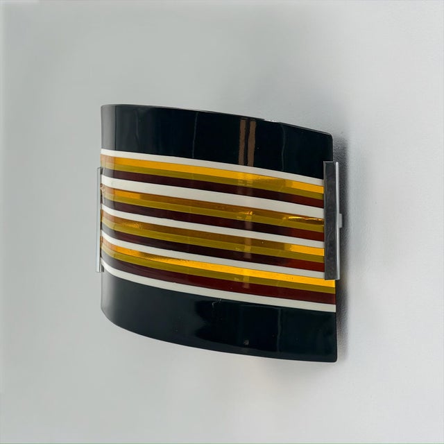 This unique wall light was handcrafted by futura t&b in murano, italy, after 2000. Produced as a one-of-a-kind piece, it...