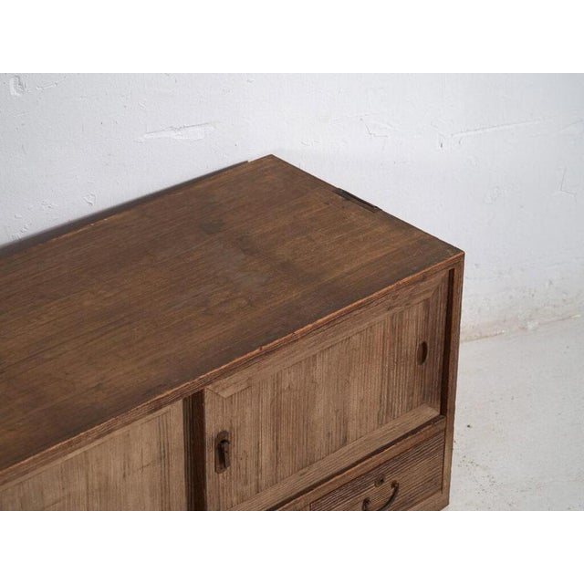 Low cabinet with antique sliding doors – Taishō / Showa period (c.1920-1970) Dimensions: Length: 94 cm Depth: 43 cm...