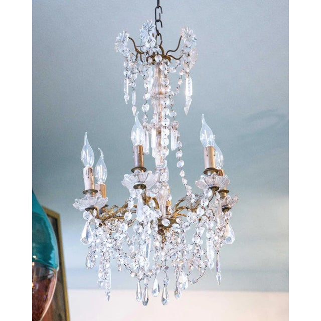 Elegant Small French Antique 6-Lights Crystal Chandelier. Materials & Techniques: Brass, crystals Provenance: France...
