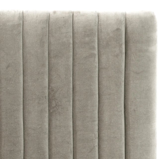 At the center of any well-designed room is a bold bed design. With its sleek vertical ribbed headboard, upholstered in...