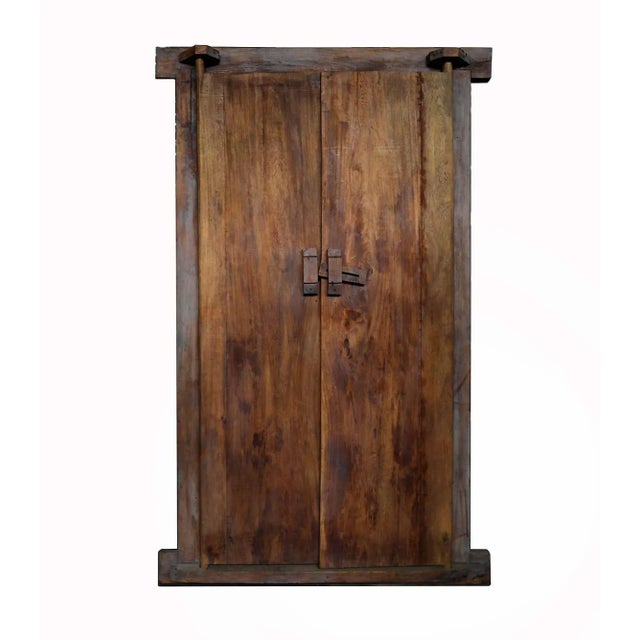 Pair of vintage framed double Indonesian doors with carved panels. The backside has solid shutters with a latch. Opening...